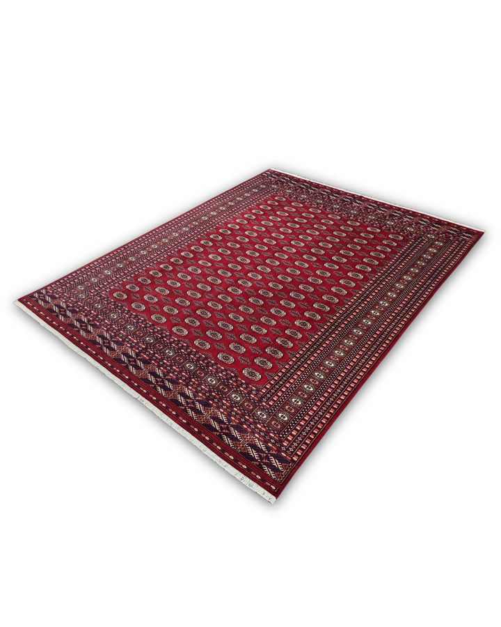 Madder Red Turkmen Gül Bokhara Rug, Hand-Knotted Pakistani Wool