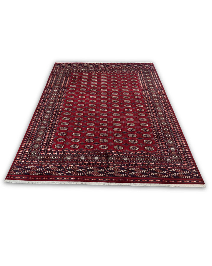 Madder Red Turkmen Gül Bokhara Rug, Hand-Knotted Pakistani Wool