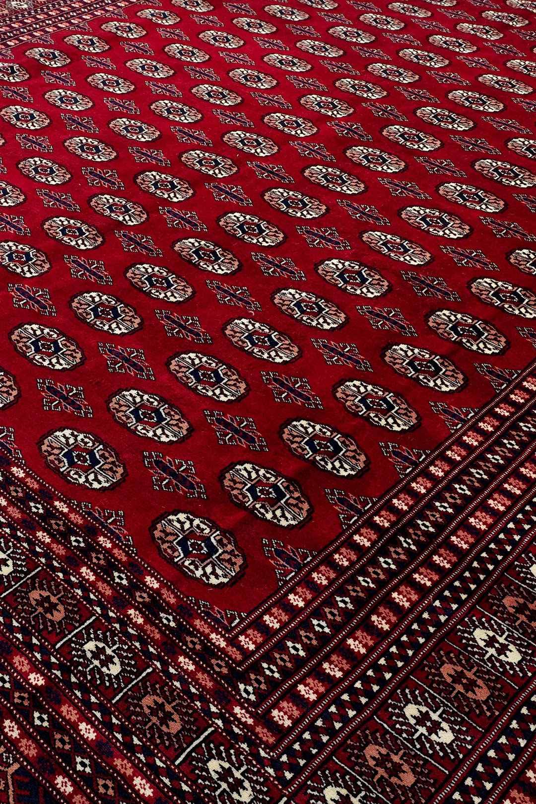 Madder Red Turkmen Gül Bokhara Rug, Hand-Knotted Pakistani Wool