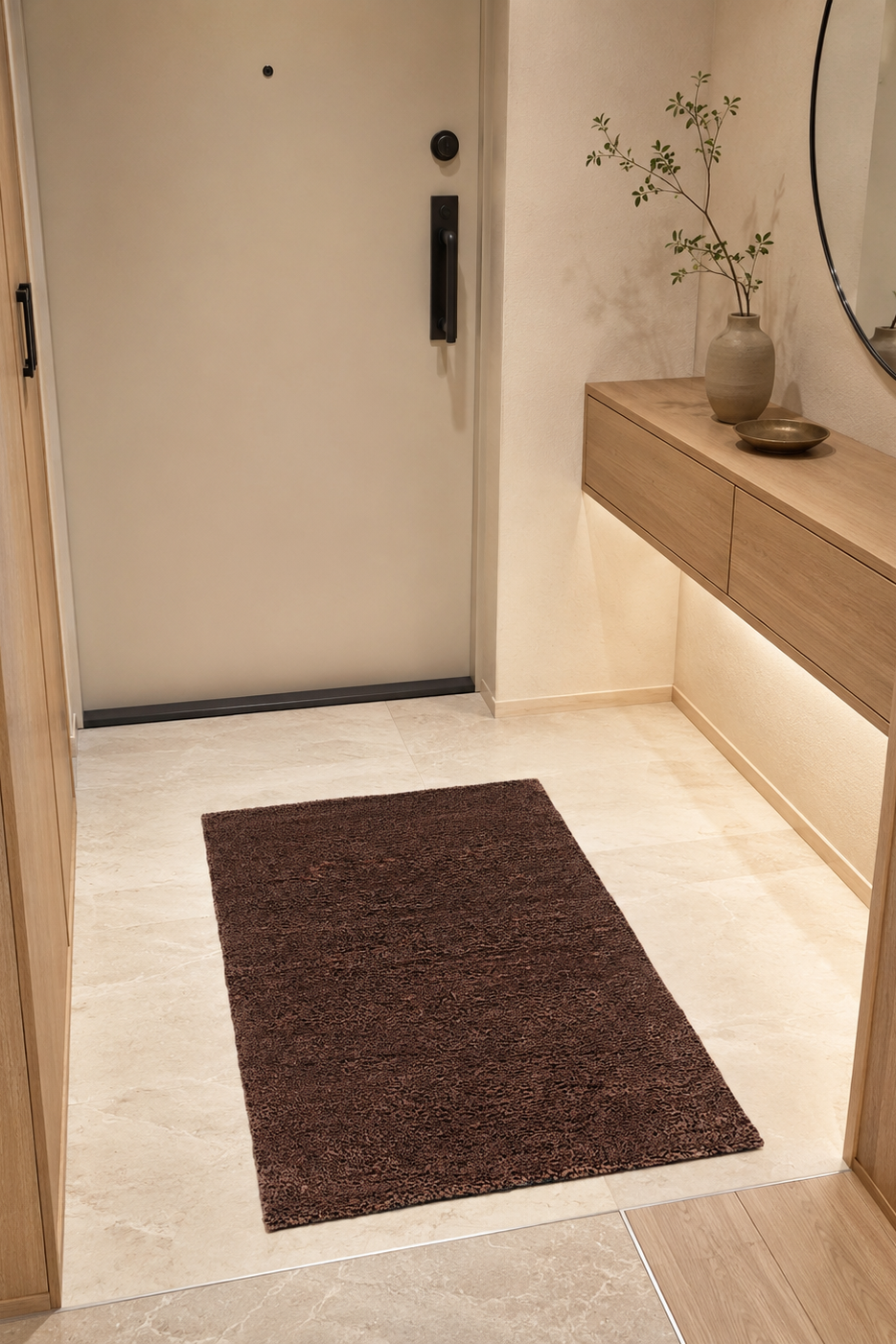 Modern interior with a brown rug on a light wood floor, a wooden console table, and decorative elements.