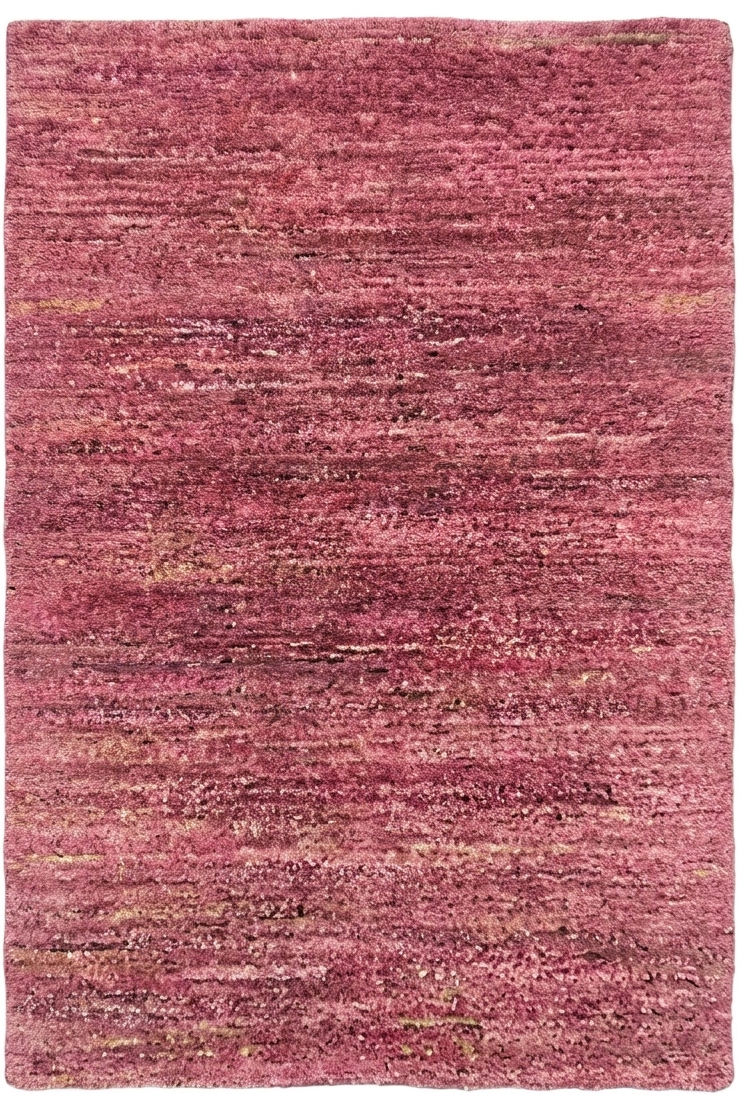 Pink textured rug on a white background