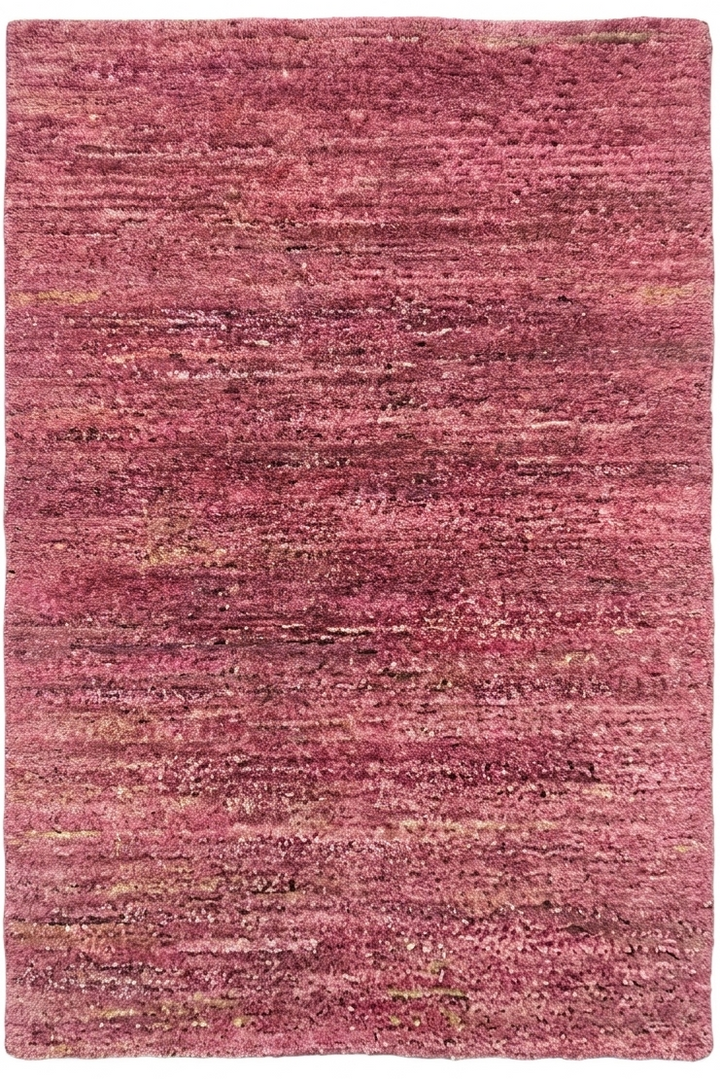Pink textured rug on a white background